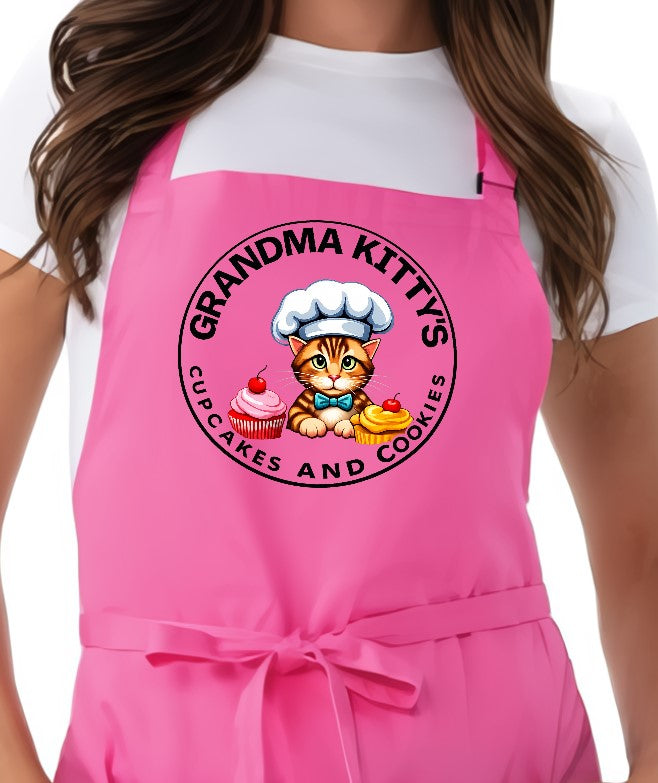 Grandma Kitty’s pink adjustable chef apron with cupcakes and cookies logo