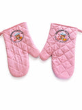 Grandma Kitty’s pink quilted oven mitts with cupcake and cookie logo